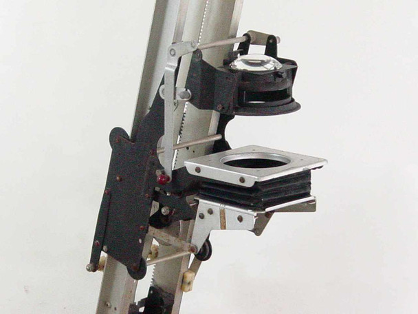 Simmon Bros Automega B7 Enlarger lens stage and bellows close-up showing lens board, bellows, and focusing hardware