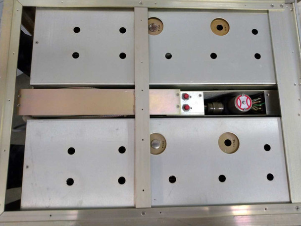 LNR DC4-D1 Down Converter top-down interior view showing four module bays, SMI SM7-219-1 coax switch (baseball) assembly mounted centrally with indicator LEDs