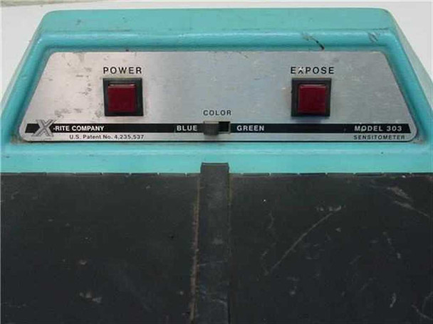 X-Rite 303 Sensitometer control panel close-up showing Power and Expose buttons, Blue/Green color selector, X-Rite Company branding and Model 303 label