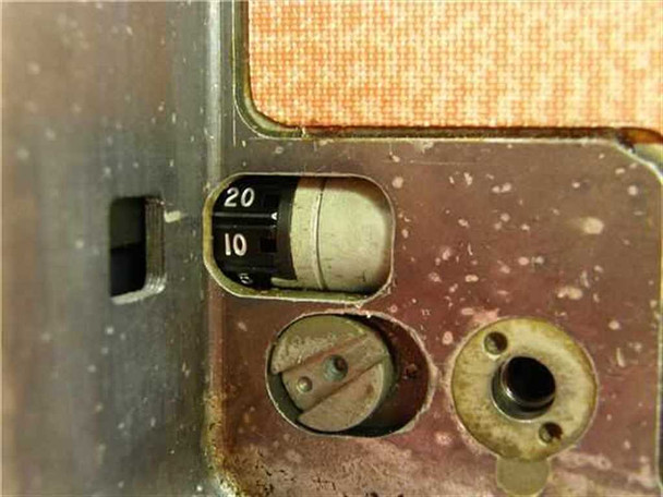 Photo-Sonics 16MM-1B camera bottom panel close-up showing frame rate selector dial marked 6, 10, 20 fps and mechanical adjustment components