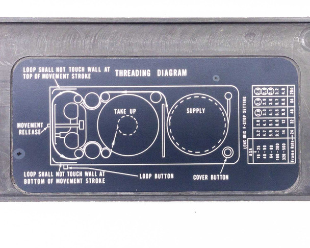 Photo-Sonics LB-24A KB-19 film magazine lid — close-up of threading diagram showing take-up and supply reel layout, loop button, cover button, and movement release labels
