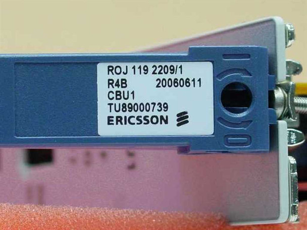 Ericsson ROJ1192209/1 label close-up on blue card ejector handle: ROJ 119 2209/1, R4B, 20060611, CBU1, TU89000739, Ericsson logo