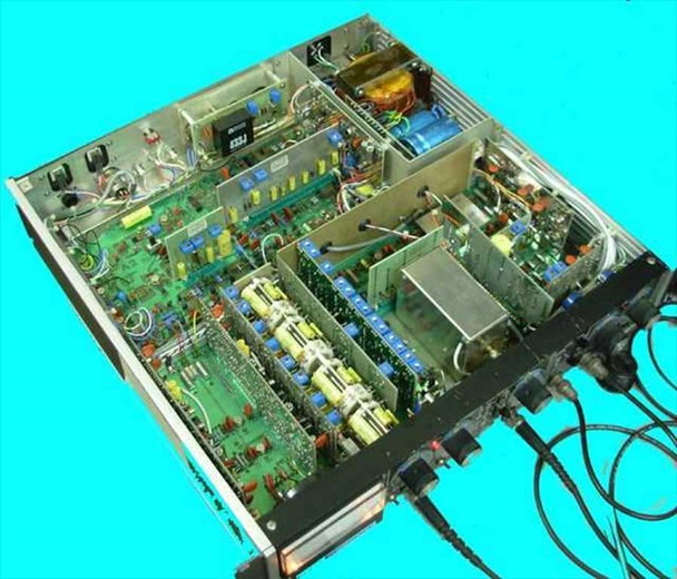 Ithaco Dynatrac 3 interior view with top cover removed — multiple PCBs, transformers, capacitors, and internal wiring visible