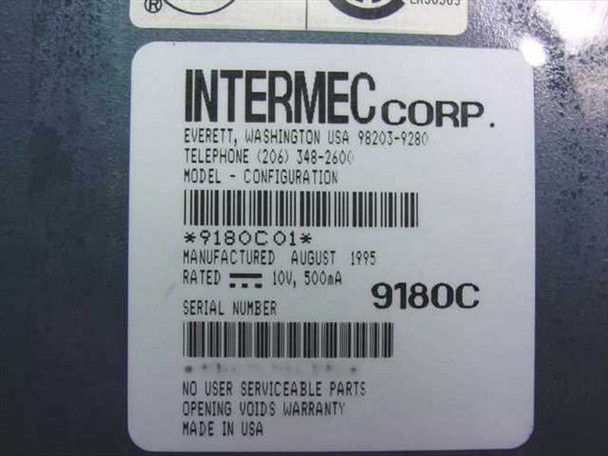Intermec Corp label on bottom of 9180C01 showing model 9180C01, configuration 9180C, manufactured August 1995, rated 10V 500mA, serial number barcode