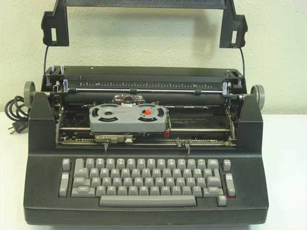 IBM Correcting Selectric II typewriter – lid open showing internal mechanism with correction tape spool assembly visible and missing print ball