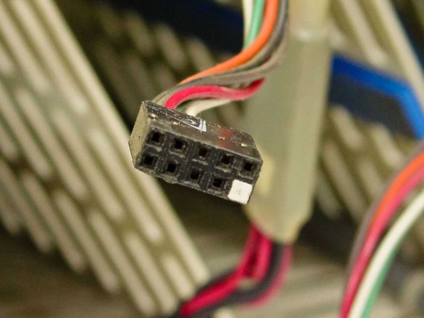 Close-up of an 8-pin drive connector from the HDR30 wiring harness showing bent and damaged pins