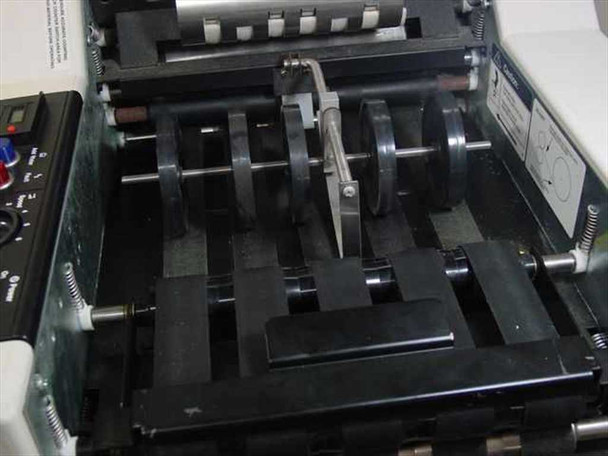 Infoseal 2612 internal buckle-chute folding mechanism with rollers and fold plates visible, top cover removed