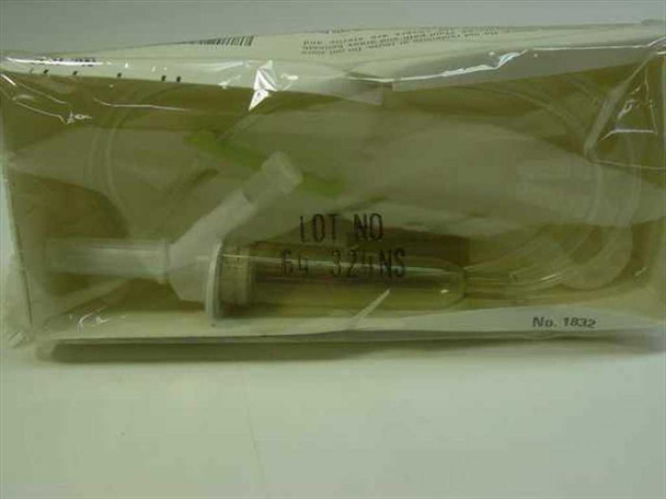 Abbott VENOSET 1832 IV piggyback set through sealed packaging showing tubing and needle assembly, Lot No. 64-324NS and No. 1832 visible