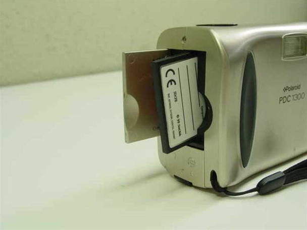 Polaroid PDC-1300 — memory card slot open with 8MB card partially inserted