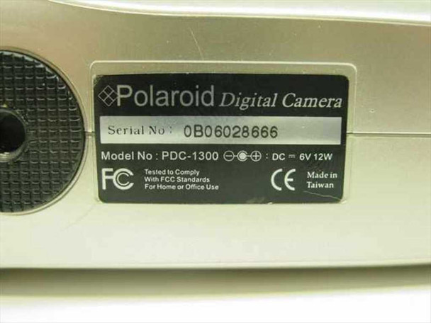 Polaroid PDC-1300 — bottom label showing serial number, model number, DC 6V 12W, FCC and CE marks, Made in Taiwan
