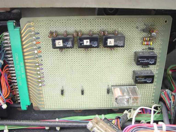 Oxberry 1500 internal control board close-up showing relay cluster labeled C, P, A with additional relay modules mounted on perforated board