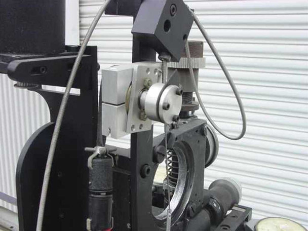 Oxberry 1500 camera carriage close-up showing pan/tilt head mount, gear ring, precision lead screw, and dial indicator