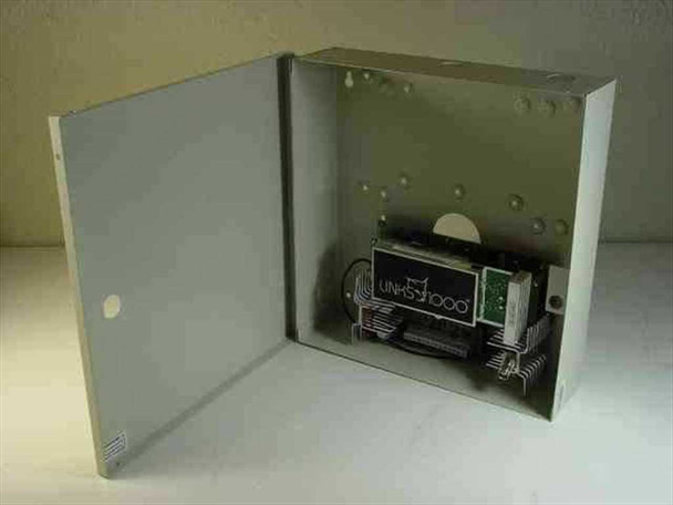 DSC Links 1000 Cellular Alarm Transmitter – open wall-mount metal enclosure showing internal PCB assembly