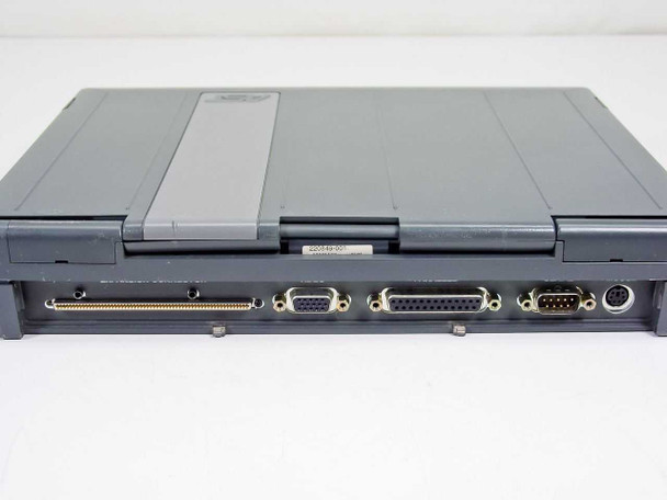AST PowerExec 3/25SL rear port view — parallel ports, DB-9 serial port, PS/2 port, PCMCIA slot, and service label visible