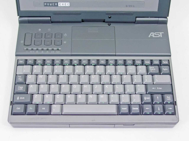 AST PowerExec 3/25SL open top-down view — full keyboard layout, trackball pad, function keys, POWEREXEC badge and AST logo