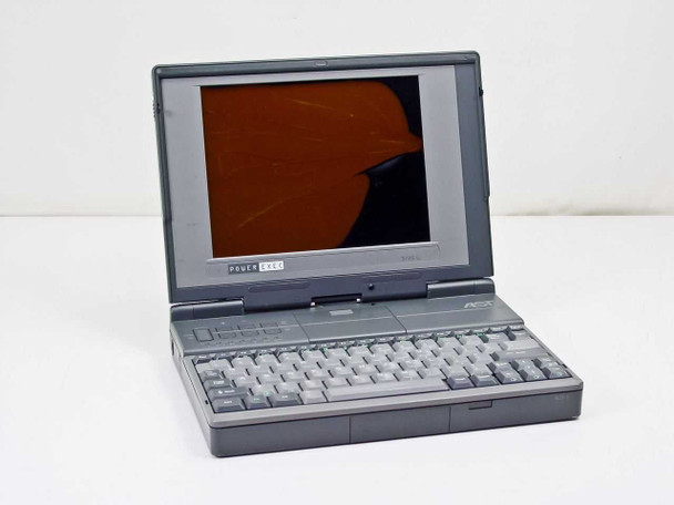 AST PowerExec 3/25SL laptop open at 3/4 angle — cracked LCD screen visible, full keyboard and AST logo on right