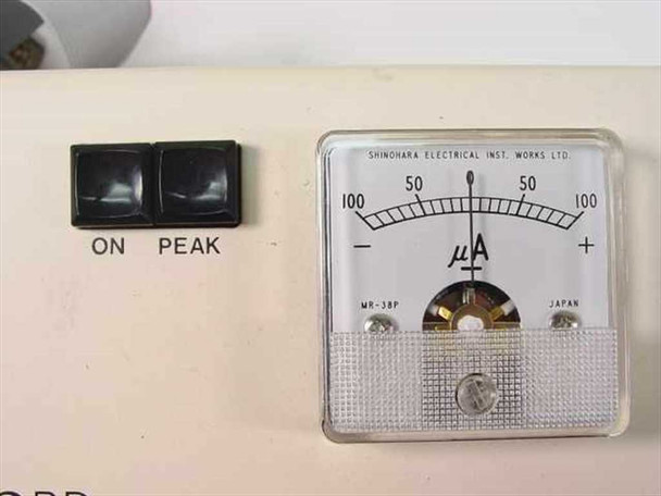 Close-up of Shinohara Electrical Inst. Works Ltd. MR-38P microammeter gauge showing ±100 µA scale and ON/PEAK buttons