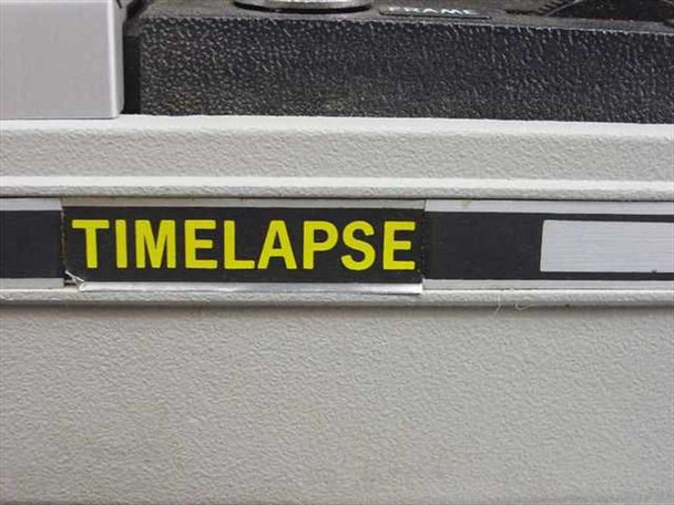 Close-up of Timelapse brand label in yellow lettering on black background on the projector body