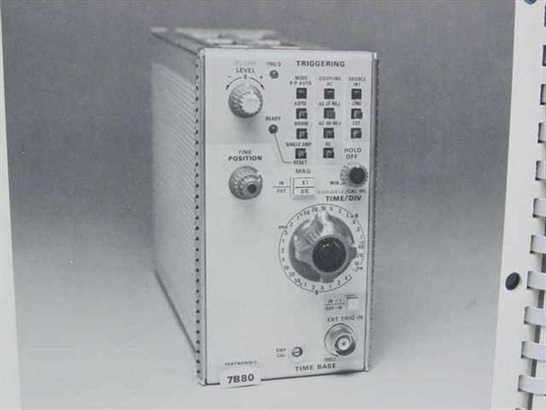 Tektronix 7B80 Time Base plug-in module photo from manual — front panel showing TRIGGERING controls, TIME/DIV knob, LEVEL, FINE POSITION, and HOLD OFF controls