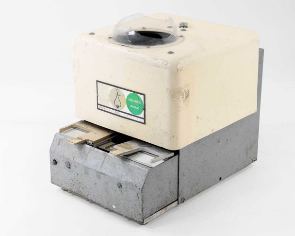 Hollywood Chicago 2816 35mm film splicer – three-quarter front view showing cream-colored upper housing and gray lower splicing drawer