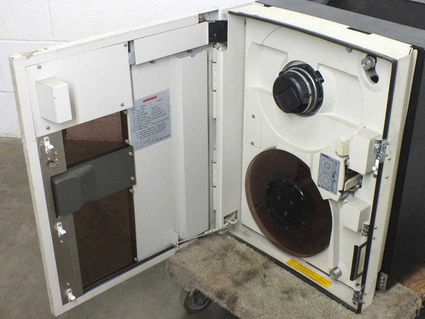 Fujitsu M2444AC tape drive – door open showing take-up reel hub and supply reel assembly inside Wiltec cabinet