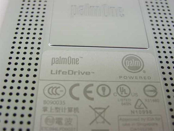 palmOne LifeDrive close-up of rear label showing palmOne and Palm Powered branding, regulatory markings, and certifications
