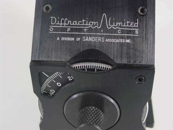 Close-up of Diffraction Limited Optics engraved logo reading 'A Division of Sanders Associates Inc.' with calibrated focus wheel and scale (-40 to 0 to 2)