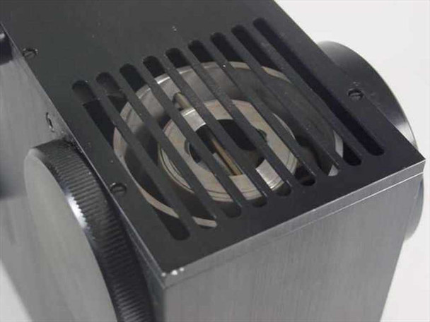 Top ventilation grille close-up showing finned aluminum grille with internal optical lens element visible beneath