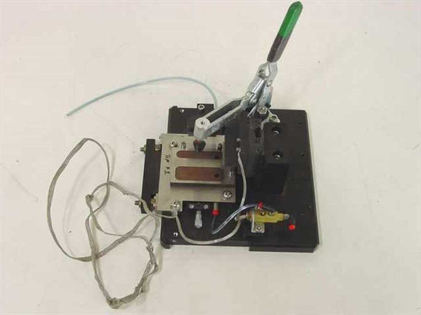 Custom PCB test jig fixture showing opposite angle — Carr Lane toggle clamp, brass pneumatic valve, red-capped fittings, and ribbon cables visible