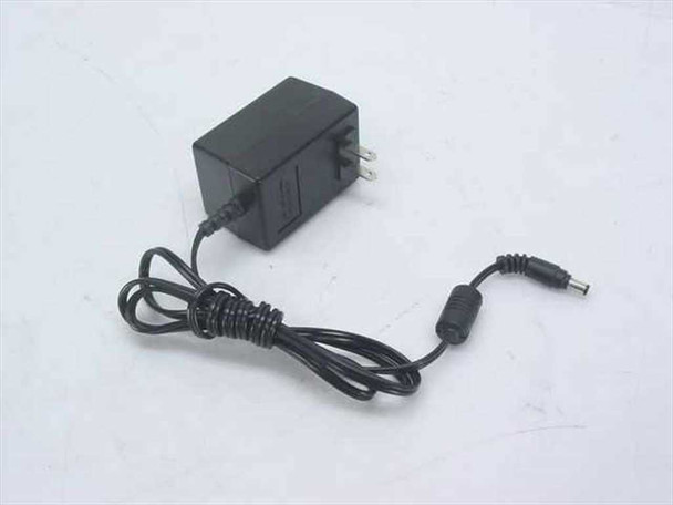 YHI YS-1015-U12 AC adapter full view showing black wall adapter body with attached DC output cable and barrel plug connector