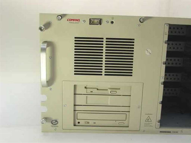 Compaq ProLiant Series 3135 server – close-up front panel showing Compaq logo, ventilation grille, floppy drive, and CD-ROM drive