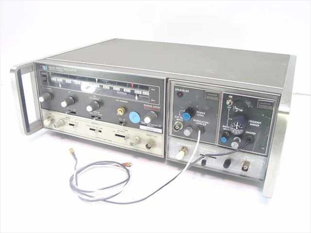 HP 8620C Sweep Oscillator with Hughes plug-ins installed – front panel and right side view showing frequency dial and controls