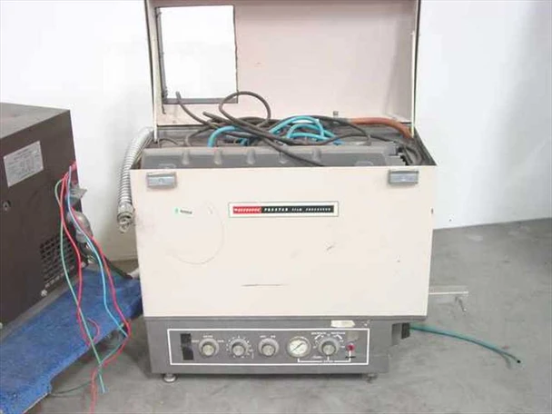 Recordak Prostar DVR darkroom film processor – front three-quarter view with lid open showing internal plumbing and hoses