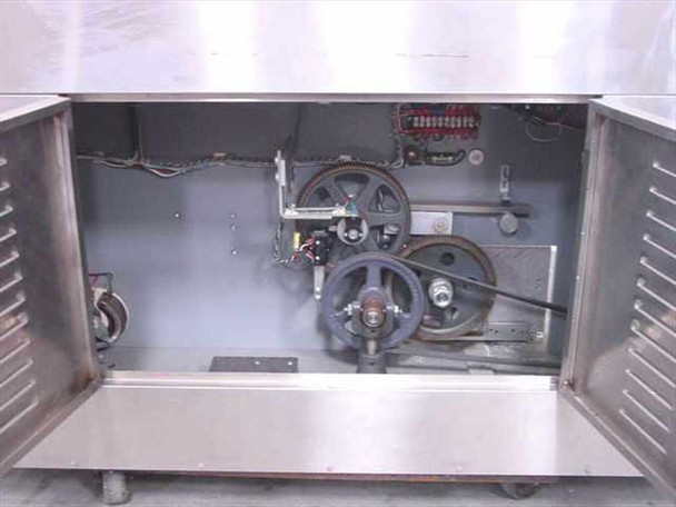 ENM 16 edge coding machine interior view with cabinet doors open showing drive wheels, belt drive system, mechanical components, and wiring