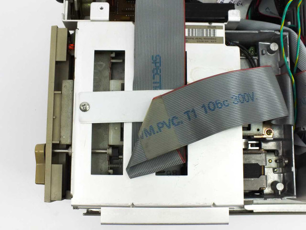 Wang PC240-3 interior close-up — 5.25-inch floppy drive mechanism and ribbon cables from above with top cover removed