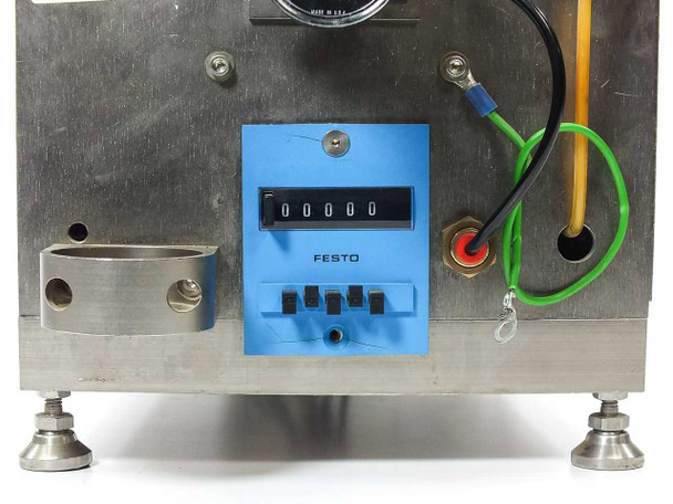 Micro Tooling MT0268 close-up of Festo mechanical counter (reading 00000) with four push-button reset switches on blue panel, mounted to stainless steel side panel
