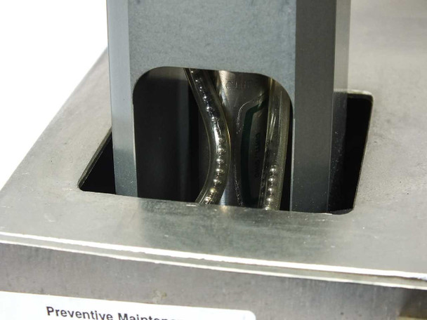 Micro Tooling MT0268 close-up of 2mm stainless steel ball bearing feed channel showing bearings queued in the precision-machined bearing guide track