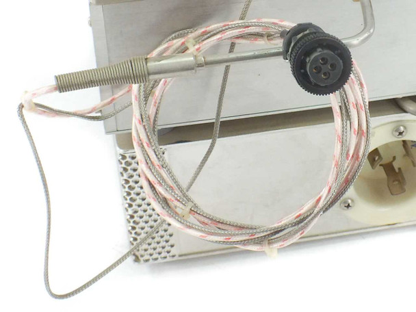 Close-up of braided thermocouple cable with spring-tip probe and multi-pin circular connector