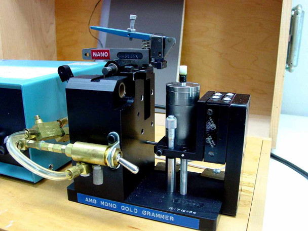 AMG Mono Gold Grammer air-actuated precision jig close-up with Nano probe head, pneumatic cylinder, and brass fittings — ID-P1890C label visible on base