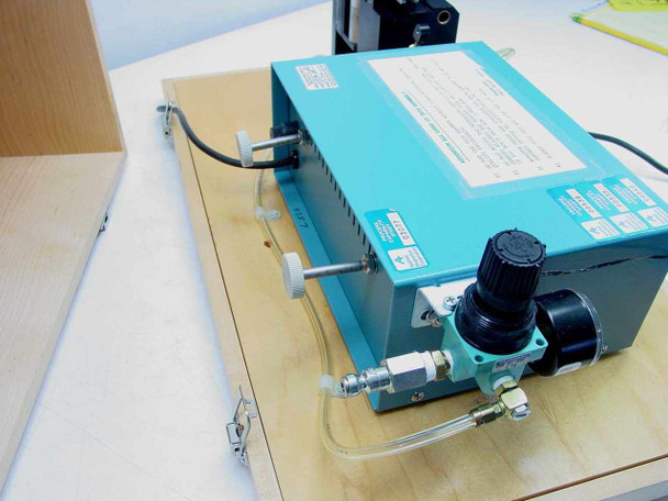 Rear view of AMG Mono Monolithic Gold Grammer electronic display unit showing pneumatic regulator, air fittings, and specification labels