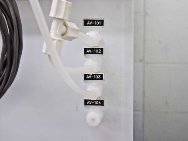 Four labeled air-operated valve ports AV-101 through AV-104 on cabinet side panel with white plastic valve bodies