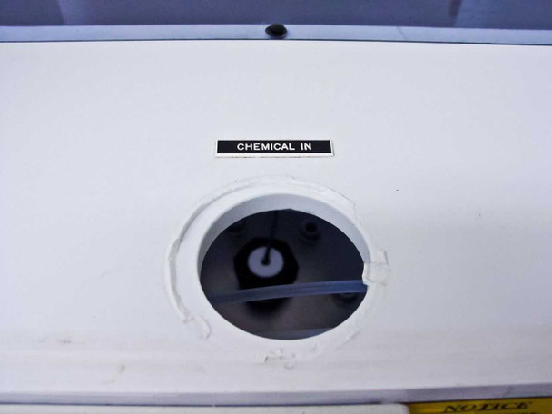 Front panel labeled CHEMICAL IN port with white PVC fitting and partial NOTICE label visible