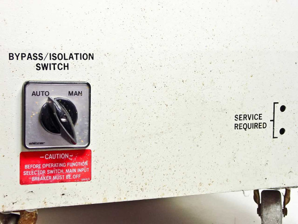 AAA Power System Constant Power 6 — Bypass/Isolation Switch close-up showing AUTO/MAN rotary selector and SERVICE REQUIRED indicator; caution label visible