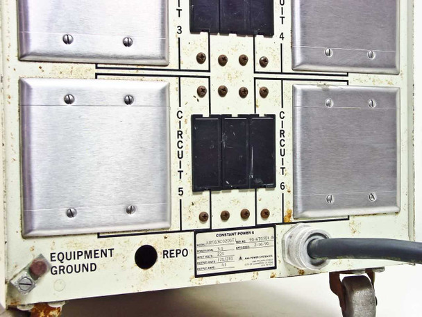 Constant Power 6 rear panel lower section — Circuits 3 through 6; Circuits 3 and 4 have blank cover plates; Circuits 5 and 6 with breakers; Equipment Ground and REPO terminals visible