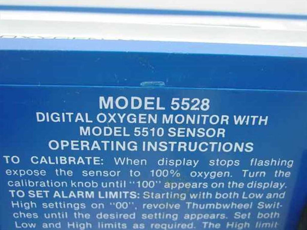 Close-up of Model 5528 operating instructions label — Digital Oxygen Monitor with Model 5510 Sensor calibration and alarm setting instructions