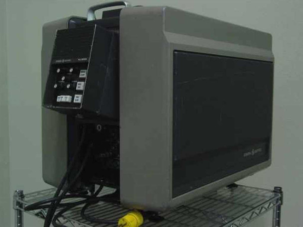 GE Talaria PJ5055C1 — left rear three-quarter view showing control panel, cabling, and yellow power cord at base; General Electric badge visible on right side panel