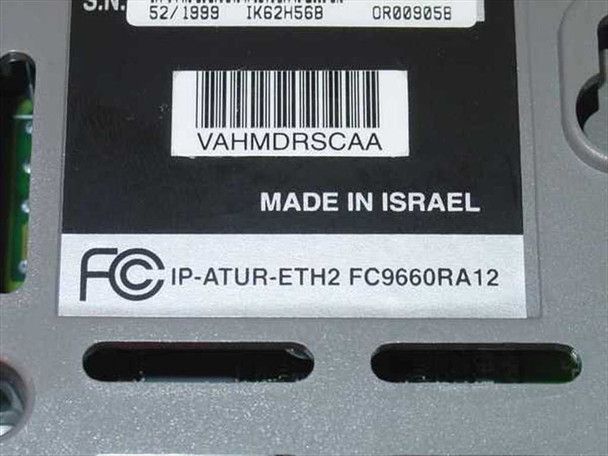 Fujitsu Speedport FC9660RA12 bottom label showing FCC ID IP-ATUR-ETH2, Made in Israel, serial number, and barcode