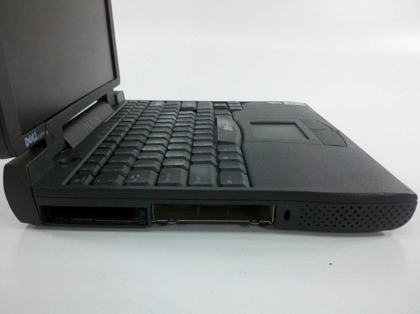 Dell Latitude CPi D266XT right side showing keyboard, two empty modular drive bays, and speaker grille