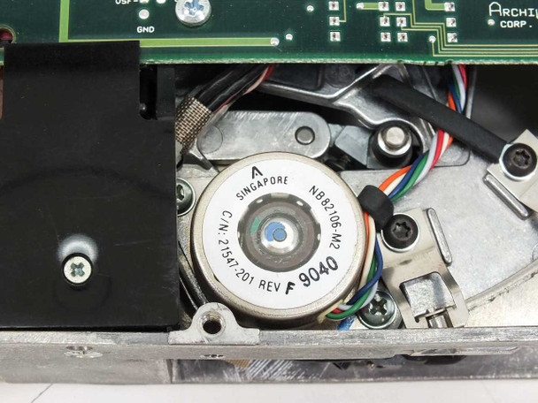 Archive 2150L tape drive – closeup of reel/drive motor labeled NB8206-M2, C/N 215471201 Rev F, LOT 9040, Singapore, with white and green wires attached