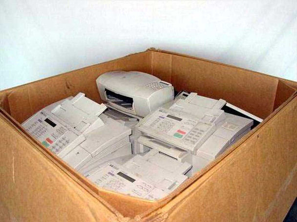 HP OfficeJet 300 and 500 all-in-one printer fax copier units piled inside open Gaylord box showing approximately 25 units